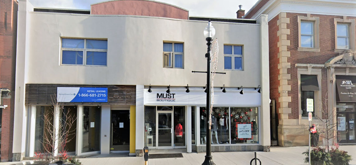 Storefront with for lease sign on facade located at 168-172 Lakeshore Road East, Oakville, Ontario.